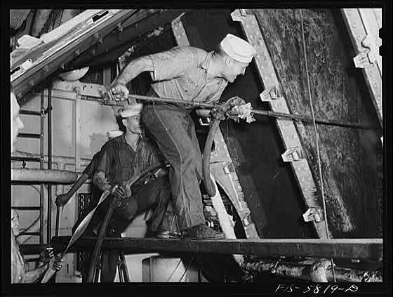 Hoffman Island, merchant marine training center off Staten Island. Trainees painting the schooner Vema.