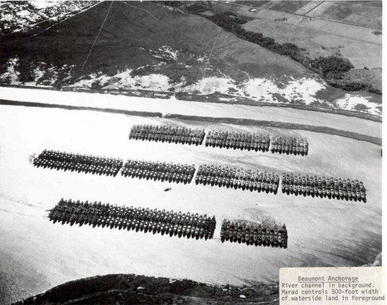 An aerial view of the Beaumont Reserve Fleet, with the Neches River channel in the background. Date unknown.