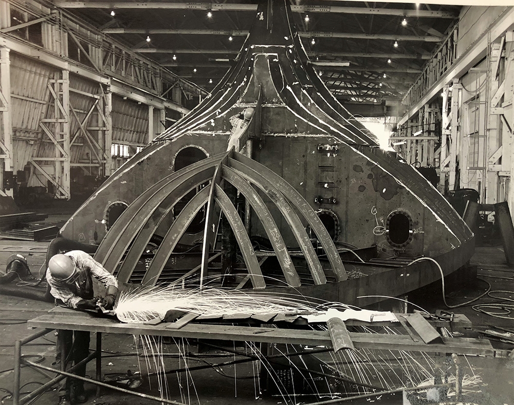 Welder working on tug boat at Bay City Marine