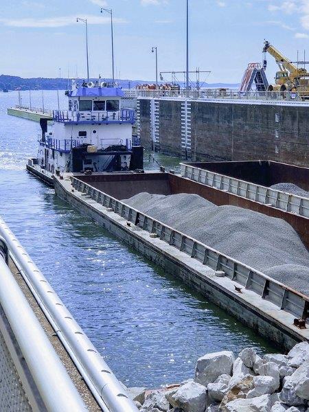A large vessel sits at a port.