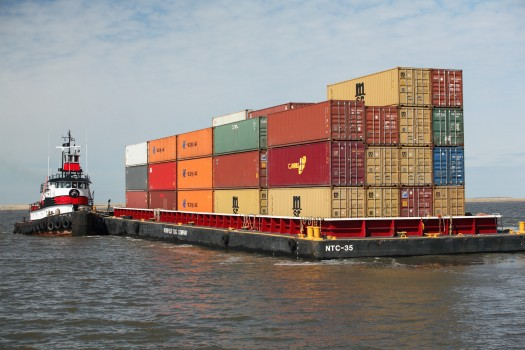 A shipping vessel loaded with colorful shipping containers.