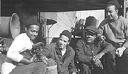 Photograph: The crew of The Booker T. Washington with the ship's mascot Photograph: The crew of The Booker T. Washington with the ship's mascot