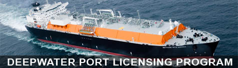Orange and black vessel in open water.